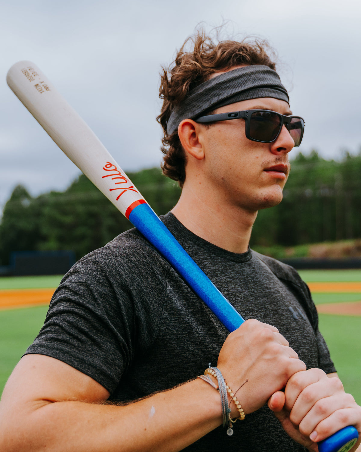 Baseball player holding a Xylo Pro wood baseball bat.